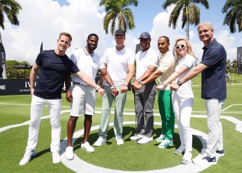 MIAMI BEACH, FLORIDA - MAY 04: (L-R) IWC Schaffhausen CEO Christoph Grainger-Herr, Dibia DREAM Founder and CEO Brandon Okpalobi, IWC brand ambassador and seven-time World Champion quarterback Tom Brady, Retired American Football running back Marcus Allen, IWC brand ambassador and seven-time Formula One World Champion Lewis Hamilton, American actor Kathryn Newton and Former F1 driver David Coulthard during The Big Pilot Challenge, an entertaining charity golf challenge organized by IWC Schaffhausen at the Miami Beach Golf Club on May 4, 2022 in Miami Beach, Florida. (Photo by Alexander Tamargo/Getty Images for IWC Schaffhausen)